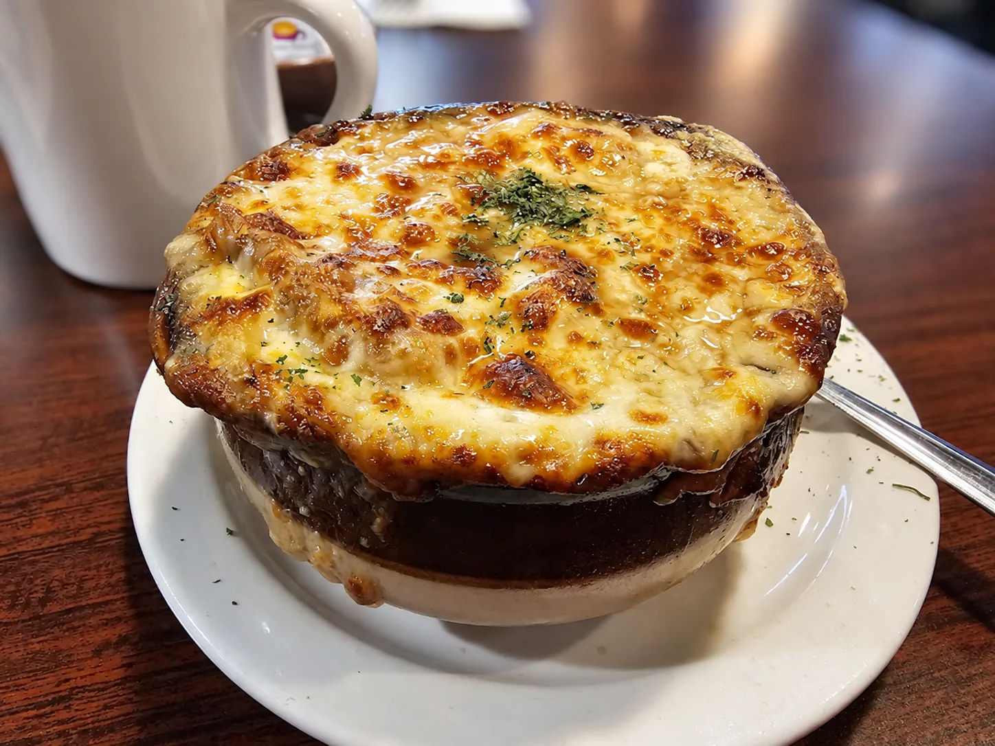 Bobola’s French onion soup, bubbling with golden melted cheese